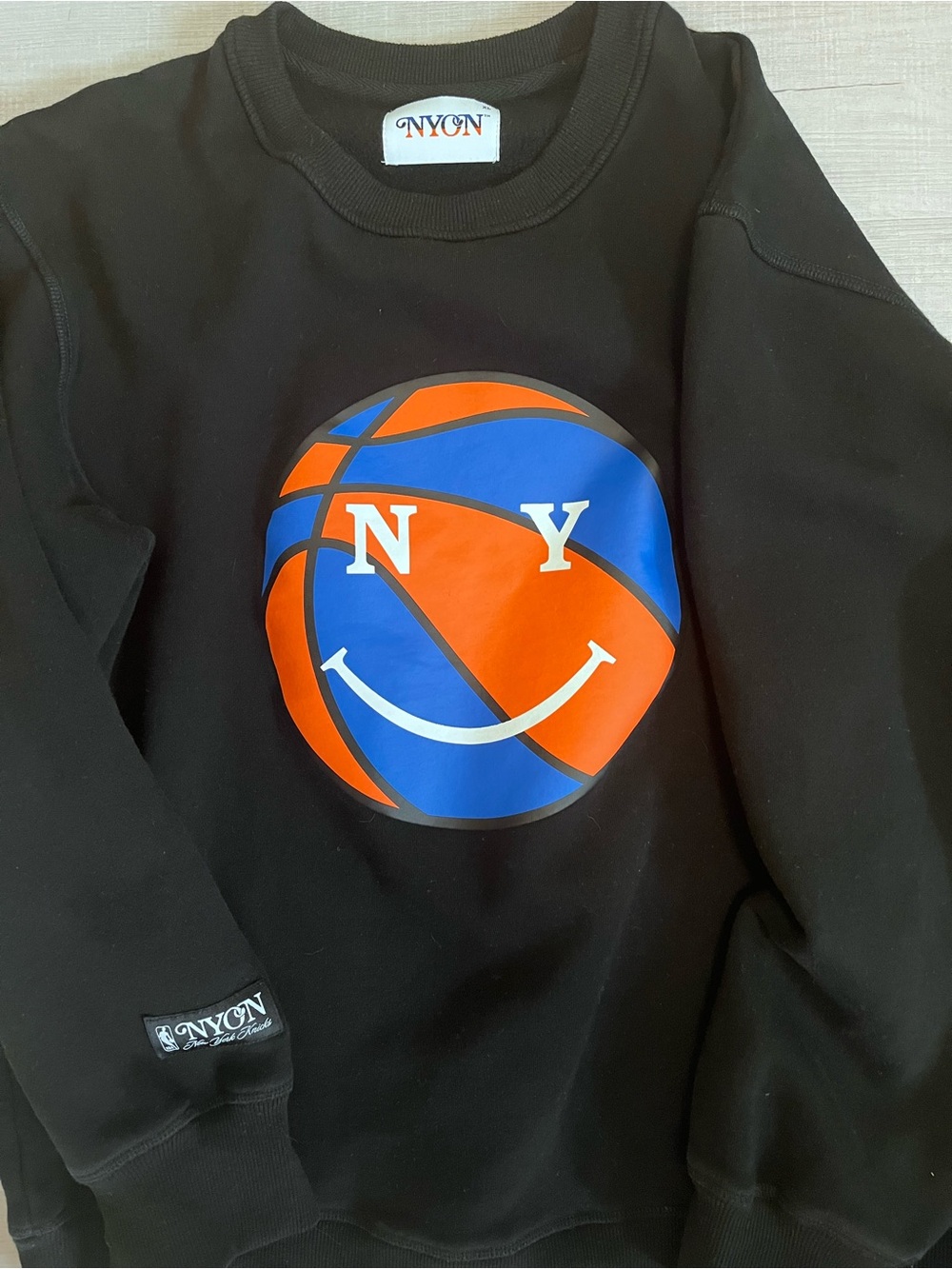 NYON Black Crewneck Sweatshirt with Blue & Orange Basketball Smile Graphic